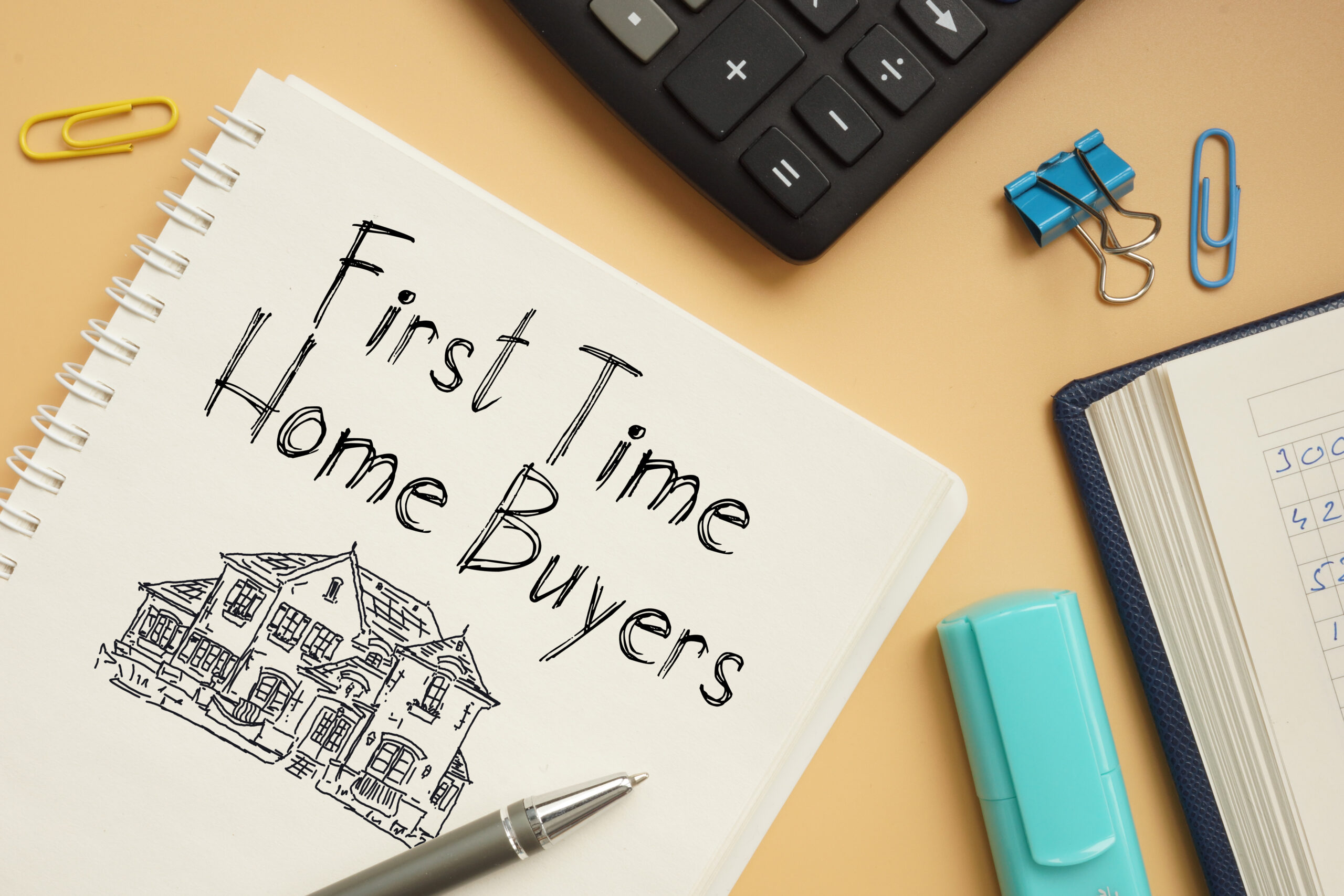 First time home buyers are shown on a business photo using the text