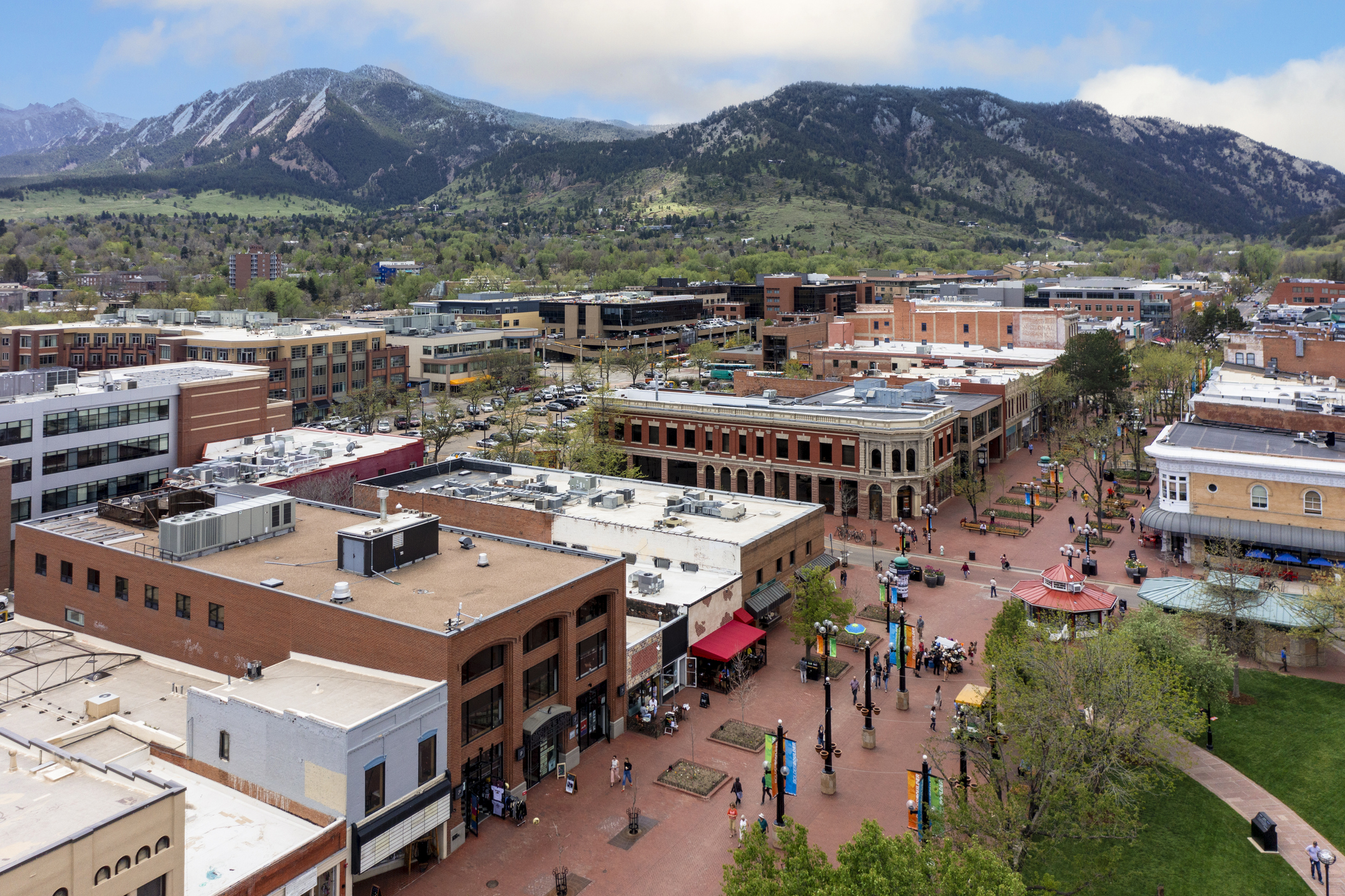 Downtown Boulder Colorado with Flatirons, where buyers can save thousands using a rebate realtor