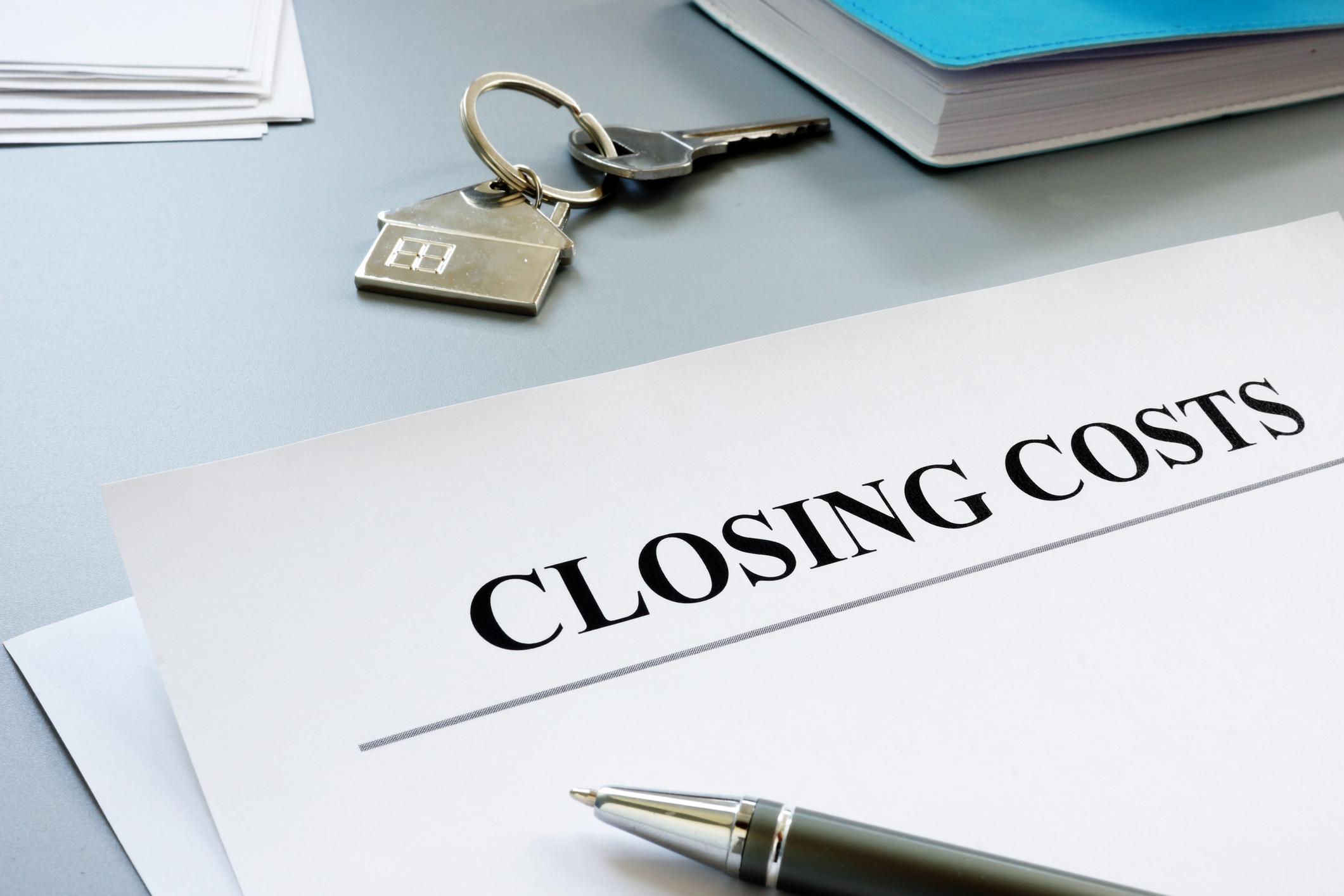 buyer commission rebate applied to closing costs with home keys and closing documents