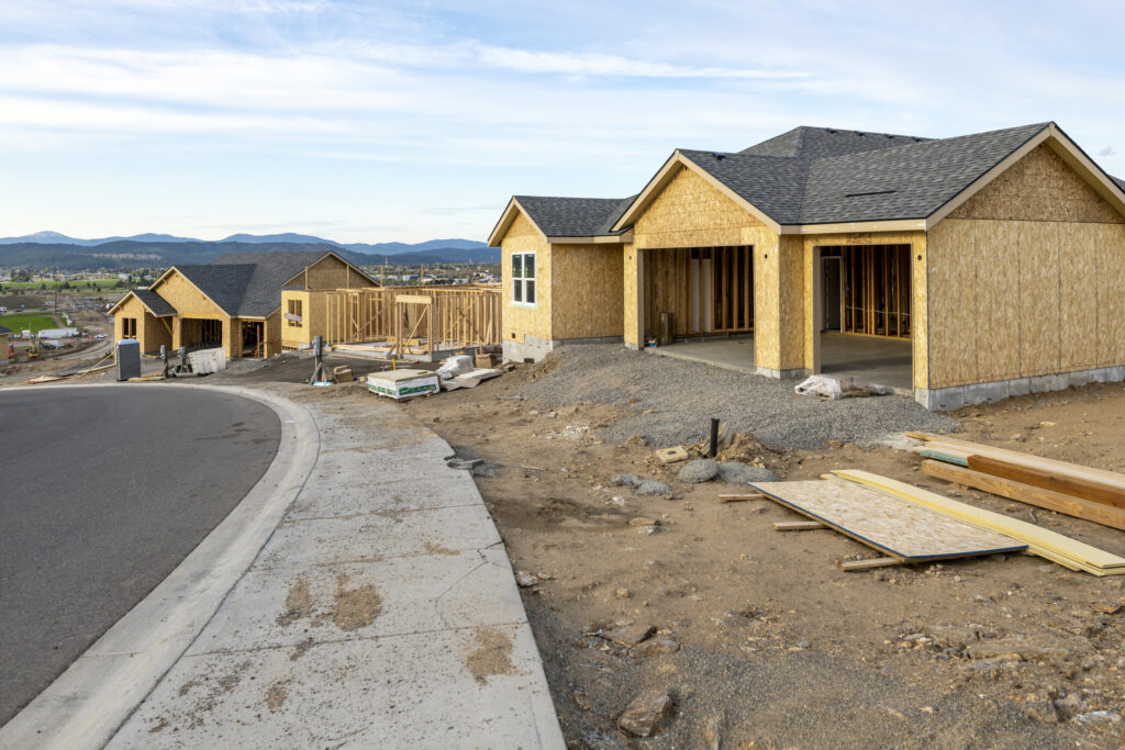Street of partially finished new homes in a new development